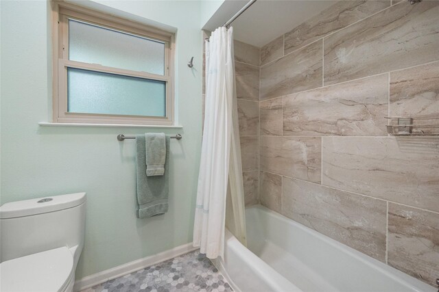 3114 Breezy Pines Ct, Kingwood, TX 77339 - full bath featuring baseboards, toilet, and shower / bath combo with shower curtain