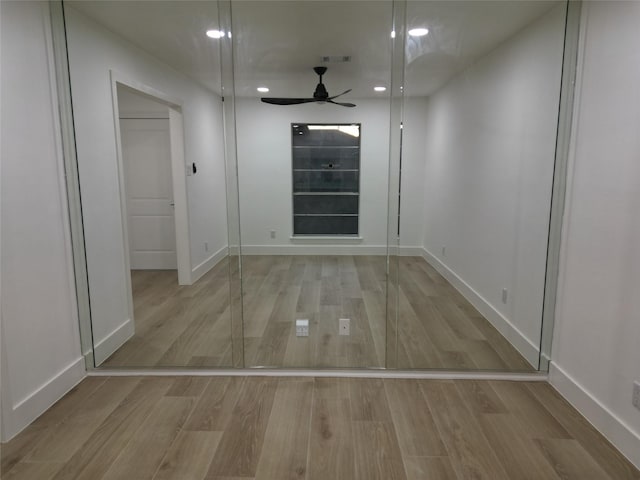 2225 W Clare St, Deer Park, TX 77536 - hallway with wood finished floors, baseboards, and recessed lighting