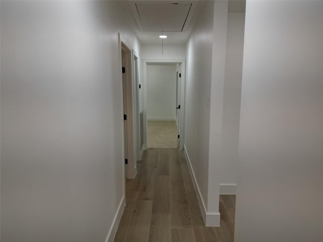 2225 W Clare St, Deer Park, TX 77536 - corridor with attic access, wood finished floors, and baseboards
