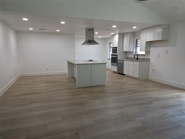 2225 W Clare St, Deer Park, TX 77536 - kitchen featuring stainless steel appliances, island exhaust hood, a sink, baseboards, and recessed lighting