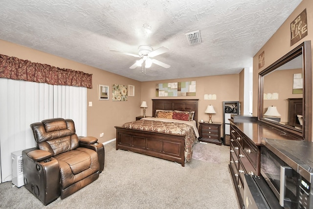 4155 Amir St, Houston, TX 77072 - carpeted bedroom featuring a textured ceiling, ceiling fan, and baseboards