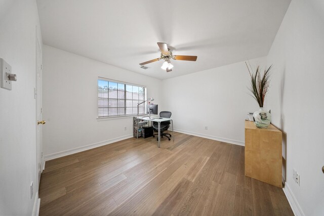 4910 Glen Hollow St, Sugar Land, TX 77479 - office area with wood finished floors, a ceiling fan, and baseboards
