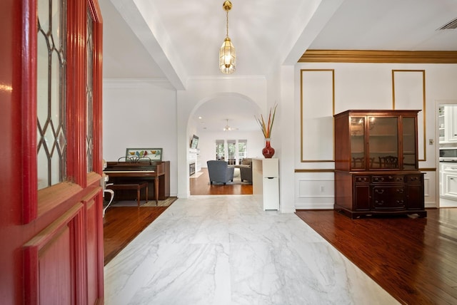 4910 Glen Hollow St, Sugar Land, TX 77479 - entryway featuring marble finish flooring, a ceiling fan, ornamental molding, and arched walkways