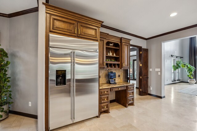 2919 Auburn Path, Sugar Land, TX 77479 - kitchen featuring stainless steel built in fridge, light stone countertops, decorative backsplash, ornamental molding, and baseboards