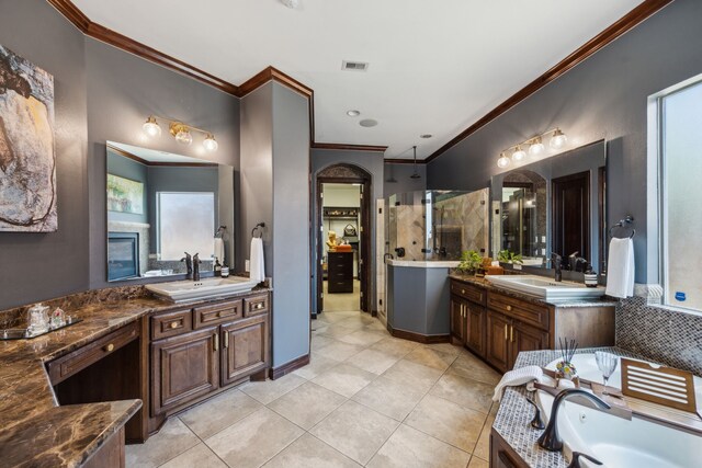 2919 Auburn Path, Sugar Land, TX 77479 - bathroom with ornamental molding, tile patterned floors, two vanities, walk in shower, and a bath