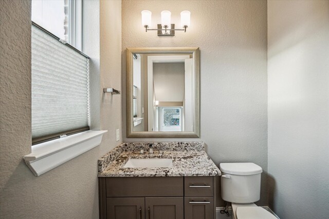 216 W Drew St, Houston, TX 77006 - bathroom featuring toilet and vanity