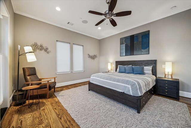 216 W Drew St, Houston, TX 77006 - bedroom featuring baseboards, crown molding, wood finished floors, recessed lighting, and a ceiling fan