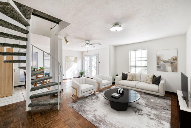 822 N Kaufman Dr, Deer Park, TX 77536 - living area with stairway, a textured ceiling, a ceiling fan, and baseboards