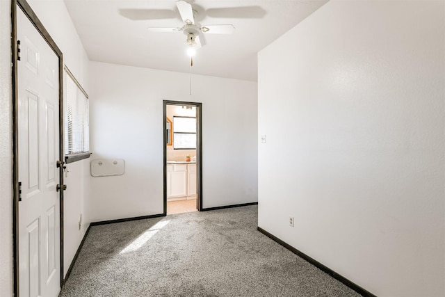 822 N Kaufman Dr, Deer Park, TX 77536 - empty room featuring light colored carpet, baseboards, and ceiling fan