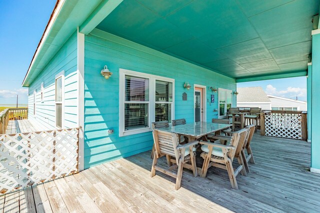 12881 Coronado Dr, Freeport, TX 77541 - wooden deck featuring outdoor dining area