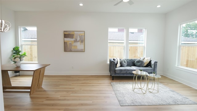7805 Avenue Ave E, Houston, TX 77012 - living area with light wood-style floors, ceiling fan, baseboards, and recessed lighting