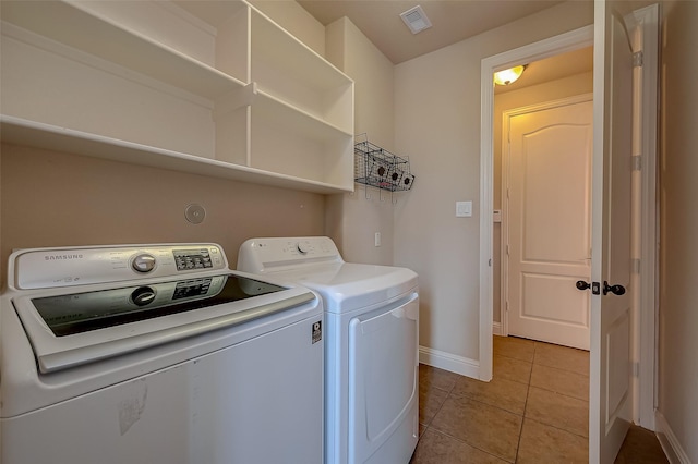 3307 Big Sky Pass, Missouri City, TX 77459 - washroom featuring washer and dryer, baseboards, and tile patterned floors
