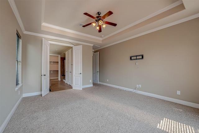3307 Big Sky Pass, Missouri City, TX 77459 - unfurnished bedroom featuring a tray ceiling, light colored carpet, ornamental molding, and baseboards