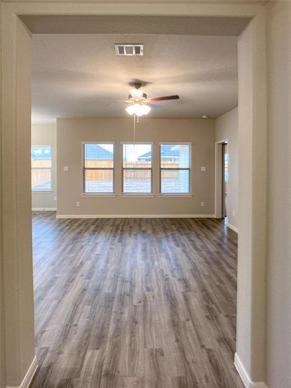 27315 Blue Pool Dr, Katy, TX 77493 - spare room featuring baseboards and dark wood-type flooring