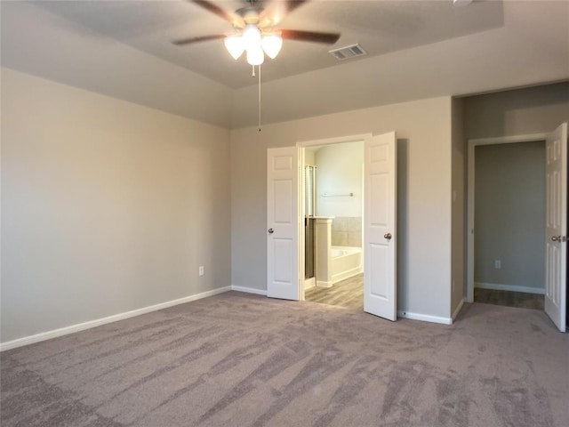 27315 Blue Pool Dr, Katy, TX 77493 - unfurnished bedroom with carpet floors, baseboards, ensuite bathroom, and a ceiling fan