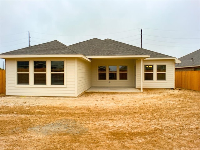 27315 Blue Pool Dr, Katy, TX 77493 - rear view of house with roof with shingles, a fenced backyard, and a patio area