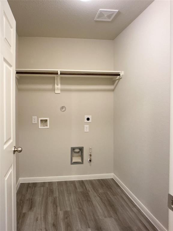 27315 Blue Pool Dr, Katy, TX 77493 - laundry area featuring gas dryer hookup, electric dryer hookup, dark wood-style flooring, and baseboards