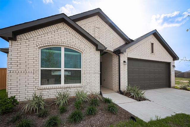 27315 Blue Pool Dr, Katy, TX 77493 - view of front of home featuring an attached garage, concrete driveway, and brick siding