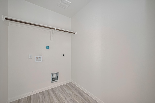27315 Blue Pool Dr, Katy, TX 77493 - laundry room with baseboards, light wood-style floors, electric dryer hookup, hookup for a washing machine, and hookup for a gas dryer