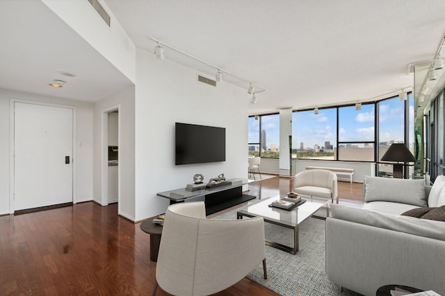 14 Greenway Plz Unit 19R, Houston, TX 77046 - living room with rail lighting, wood finished floors, and baseboards