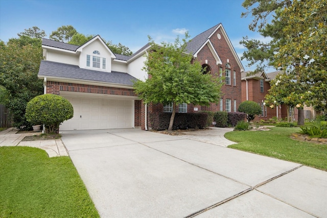 5111 Maple Hill Trl, Houston, TX 77345 - traditional-style house featuring brick siding, a front lawn, concrete driveway, an attached garage, and roof with shingles