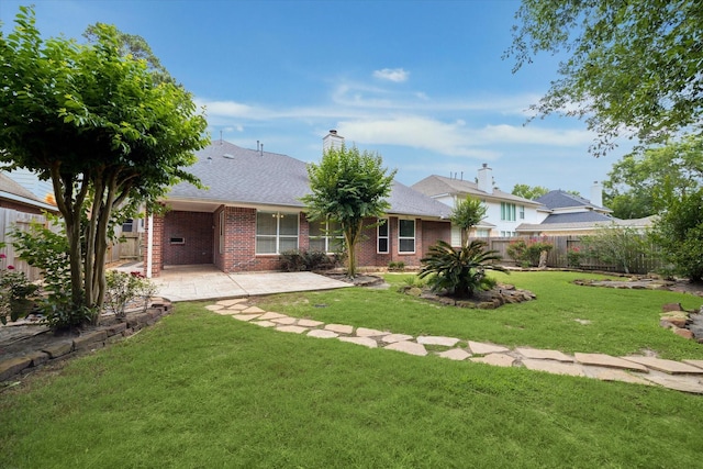 5111 Maple Hill Trl, Houston, TX 77345 - rear view of house featuring brick siding, a patio area, and roof with shingles