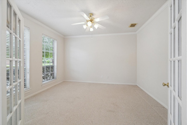 5111 Maple Hill Trl, Houston, TX 77345 - spare room featuring light carpet, ornamental molding, french doors, baseboards, and a textured ceiling