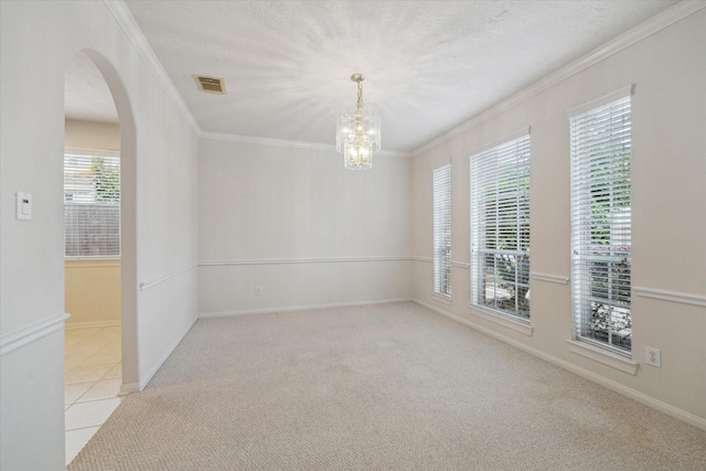 5111 Maple Hill Trl, Houston, TX 77345 - empty room with arched walkways, ornamental molding, carpet flooring, a chandelier, and baseboards