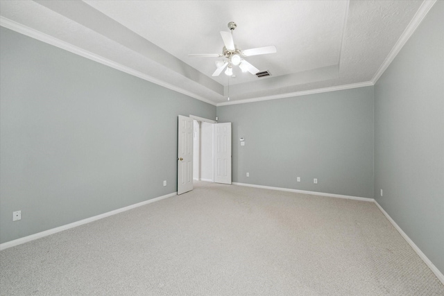 5111 Maple Hill Trl, Houston, TX 77345 - empty room with a raised ceiling, light colored carpet, a ceiling fan, baseboards, and crown molding