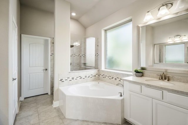 19723 Hale Hollow Creek Dr, Cypress, TX 77433 - full bathroom with a bath, vanity, lofted ceiling, a tile shower, and tile patterned flooring
