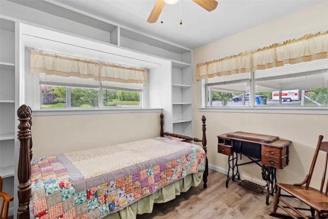 4420 Shady Ln, Huntsville, TX 77320 - bedroom with wood finished floors and ceiling fan