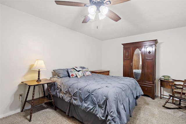 4420 Shady Ln, Huntsville, TX 77320 - bedroom with light colored carpet, baseboards, and ceiling fan