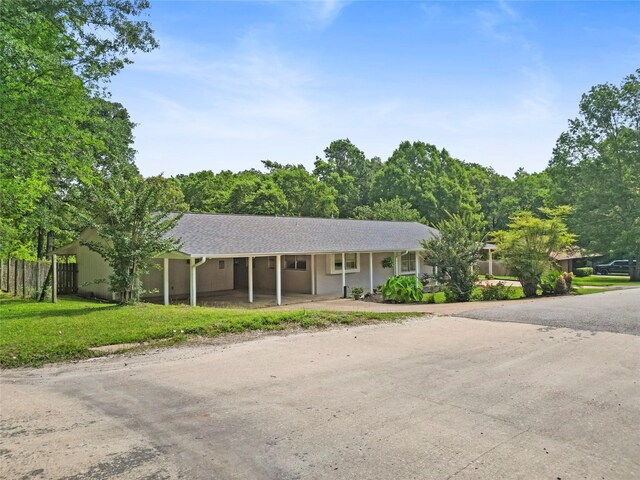 4420 Shady Ln, Huntsville, TX 77320 - ranch-style house with dirt driveway and a shingled roof