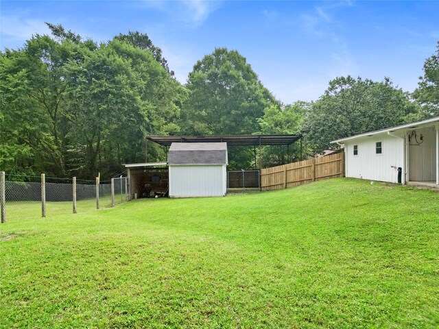 4420 Shady Ln, Huntsville, TX 77320 - view of yard featuring an outbuilding and a storage unit