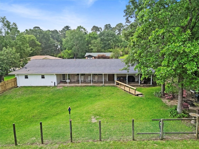 4420 Shady Ln, Huntsville, TX 77320 - view of front of house featuring a shingled roof, a patio area, and a front lawn