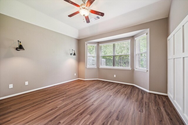 5332 Pointe Spring Xing, Spring, TX 77389 - unfurnished bedroom with dark wood-style floors, baseboards, and ceiling fan
