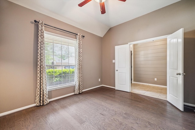 5332 Pointe Spring Xing, Spring, TX 77389 - unfurnished bedroom with wood finished floors, vaulted ceiling, baseboards, and a ceiling fan