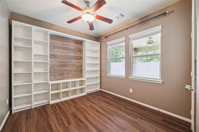 5332 Pointe Spring Xing, Spring, TX 77389 - unfurnished room with baseboards, a ceiling fan, and dark wood finished floors