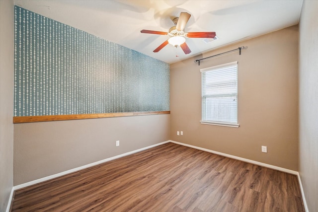 5332 Pointe Spring Xing, Spring, TX 77389 - spare room featuring wood finished floors, ceiling fan, and baseboards