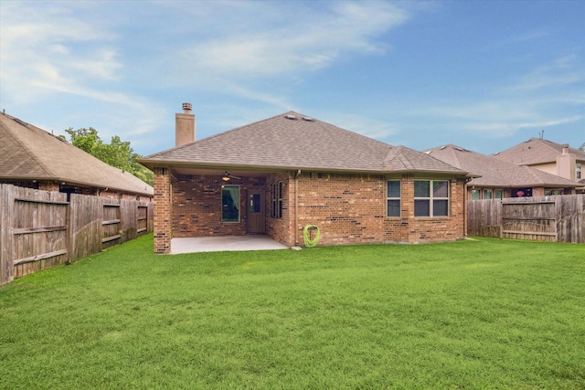 5332 Pointe Spring Xing, Spring, TX 77389 - back of house featuring a chimney, brick siding, a patio, and roof with shingles