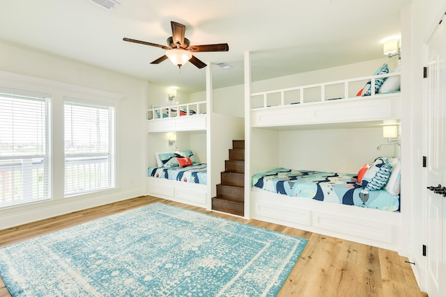 998 Austin Dr, Gilchrist, TX 77617 - bedroom with wood finished floors and a ceiling fan