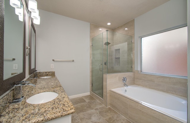 14814 Bridle Bend Dr, Houston, TX 77084 - full bathroom featuring a shower stall, a bath, double vanity, and baseboards