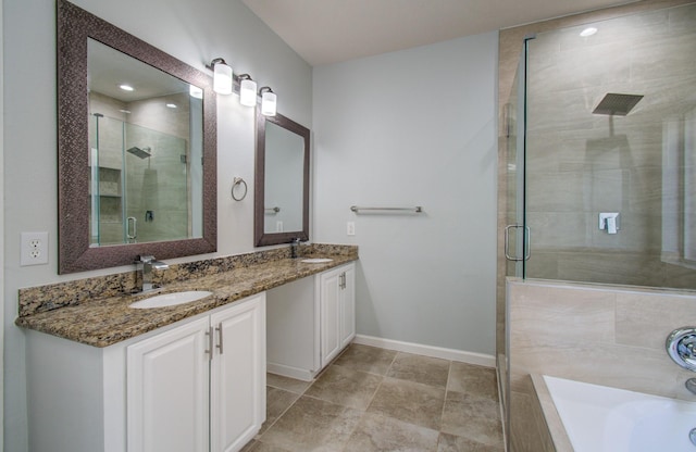 14814 Bridle Bend Dr, Houston, TX 77084 - full bath featuring a shower stall, double vanity, baseboards, a bath, and tile patterned floors