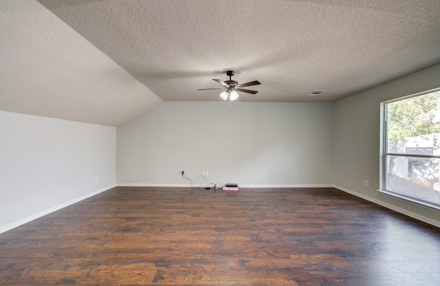 14814 Bridle Bend Dr, Houston, TX 77084 - bonus room with a ceiling fan, a textured ceiling, dark wood-style flooring, vaulted ceiling, and baseboards