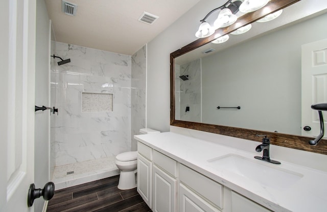 14814 Bridle Bend Dr, Houston, TX 77084 - full bathroom with a marble finish shower, toilet, vanity, and wood finished floors