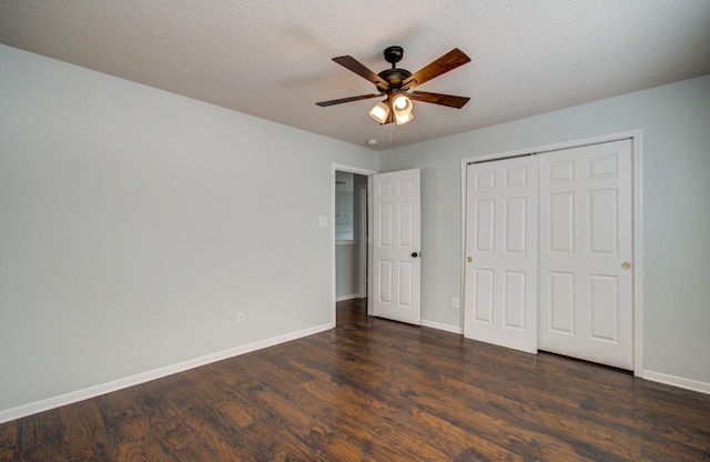 14814 Bridle Bend Dr, Houston, TX 77084 - unfurnished bedroom featuring dark wood-type flooring, baseboards, a closet, and a ceiling fan