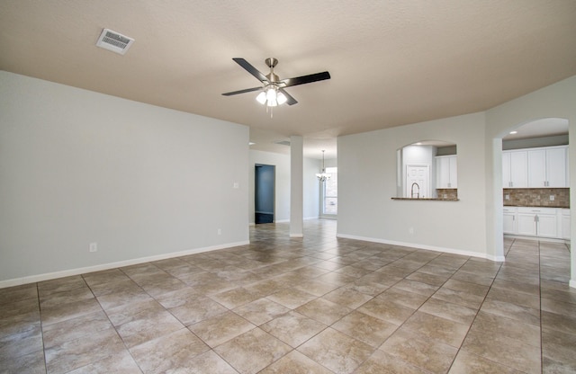 14814 Bridle Bend Dr, Houston, TX 77084 - unfurnished living room with ceiling fan, a sink, light tile patterned flooring, and baseboards