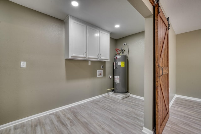 1021 S State St, Madisonville, TX 77864 - utility room featuring electric water heater