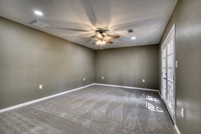 1021 S State St, Madisonville, TX 77864 - carpeted empty room with ceiling fan, baseboards, and french doors