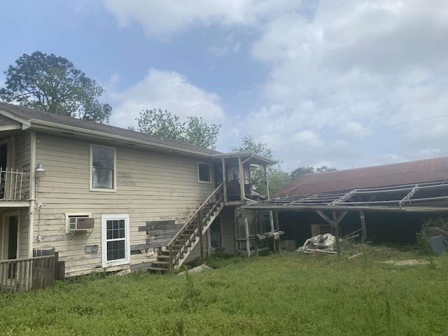 3015 Ohio St, Fresno, TX 77545 - back of house with stairs, a yard, and an AC wall unit